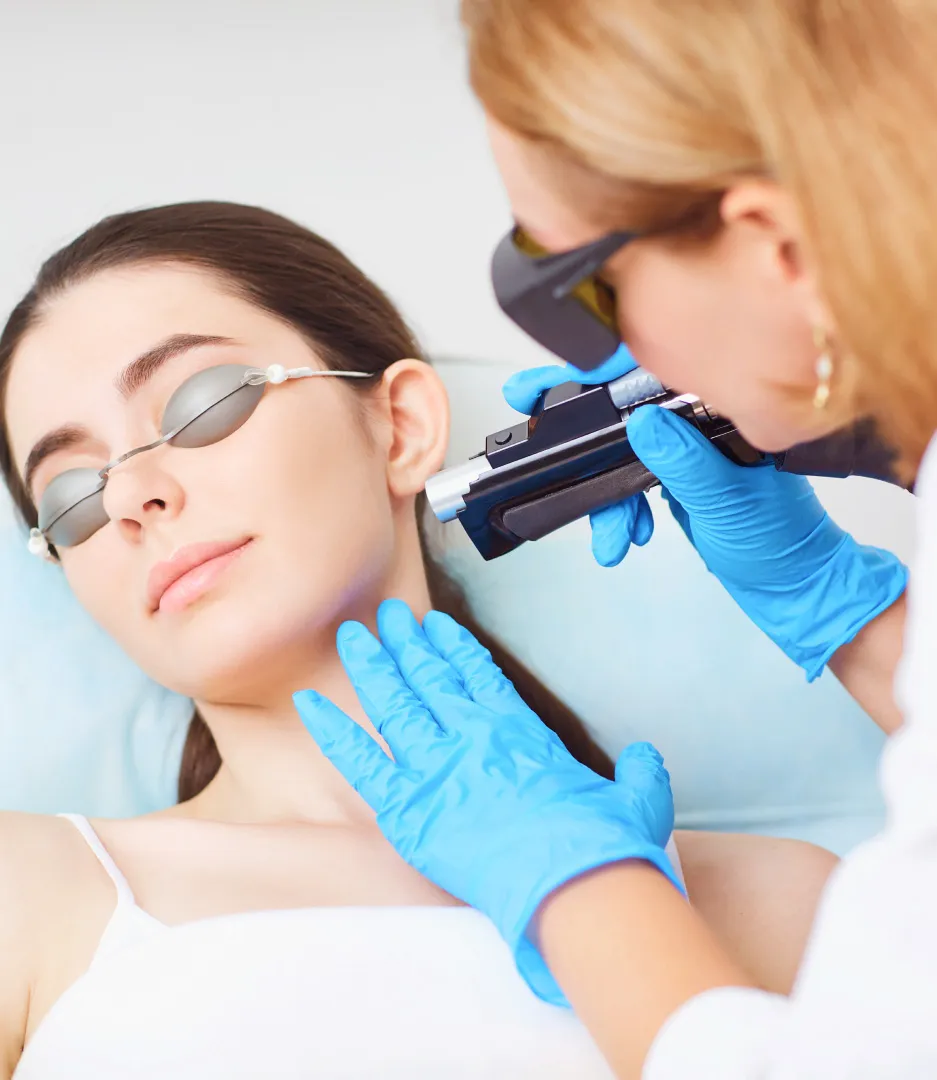 Laser skin treatment on the neck at a dermatology clinic to improve skin tone and texture, performed by a specialist.