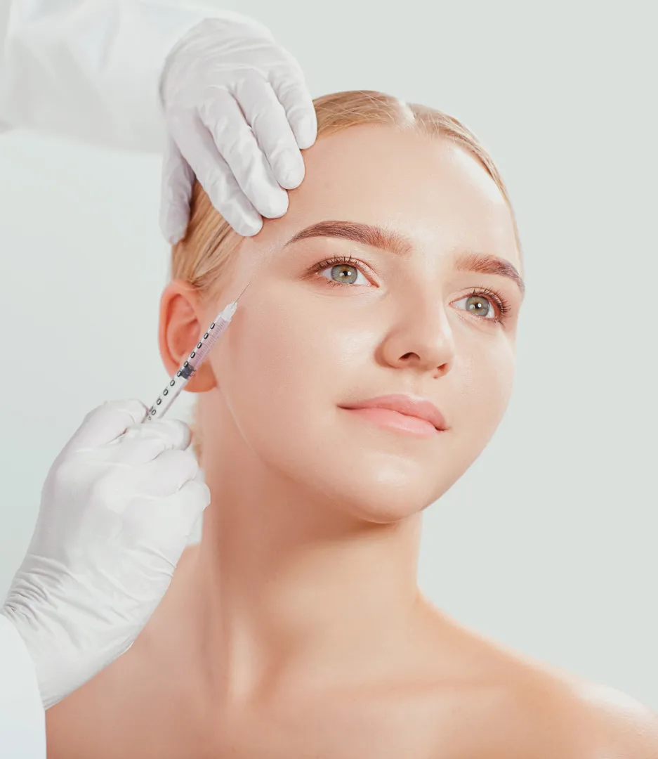 Young woman receiving Dysport injection near eye from medical professional